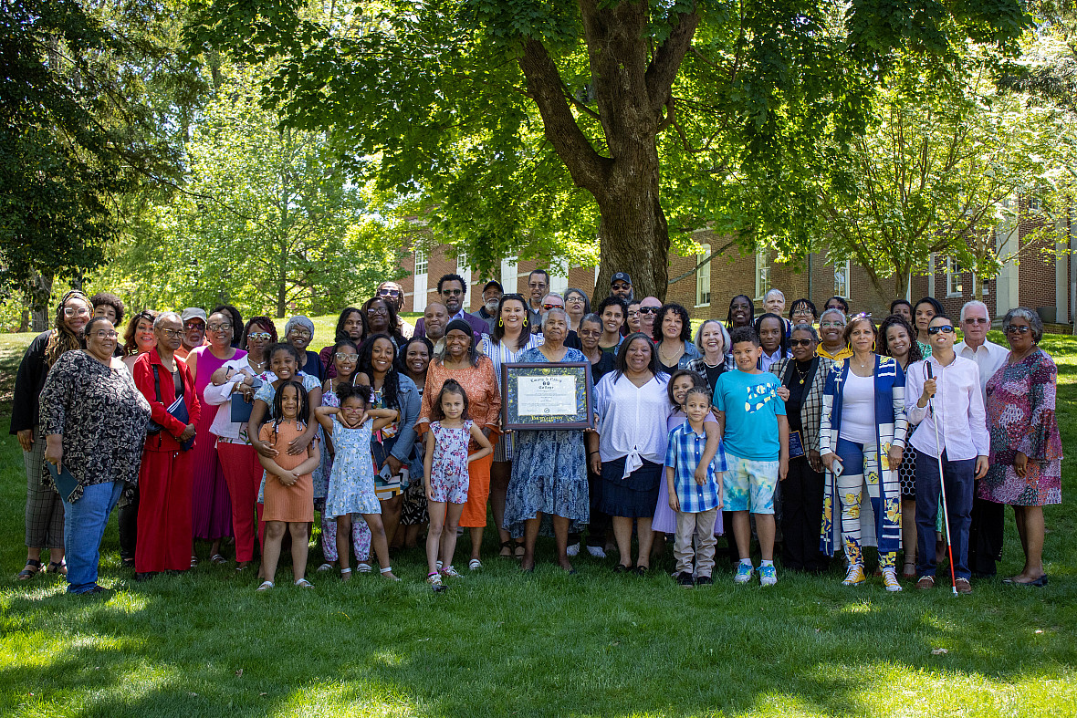 More than 70 of Henry's descendants attended the commencement ceremony, including Marie Lampkins (middle), the oldest living descendant, ...