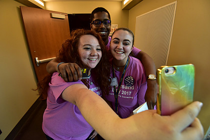 Ampersand Ambassadors enjoy taking a selfie while helping out.