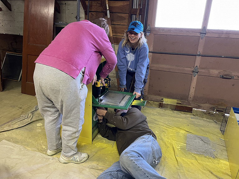 Civic Leader Scholars assisting the Appalachian Community Connectors in building Blessing Boxes t...