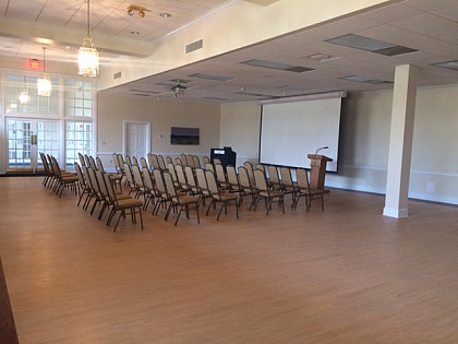The Board of Visitors Lounge set up for a lecture-style setting, available for up to 175 people.