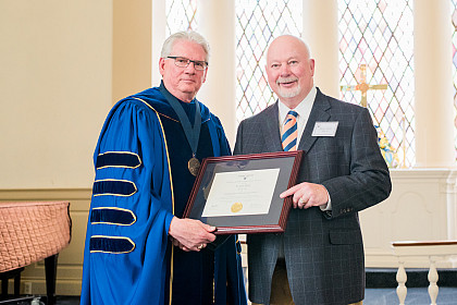 The Distinguished Achievement Award recipient The Honorable Jerry Beck '65 with President Jake Schrum