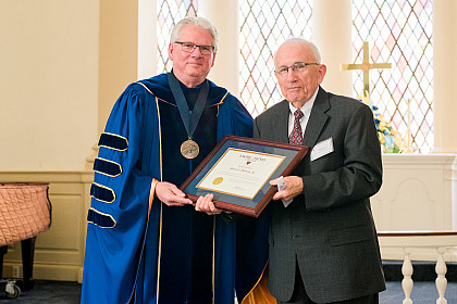 Henry Dawson is presented a college citation.