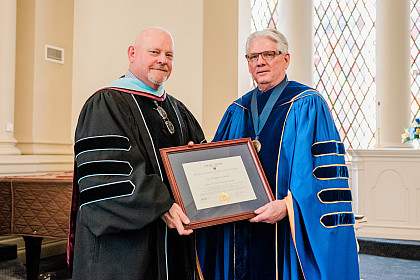 James A. Davis Faculty Award winner Dr. Douglas E. Arnold and President Schrum.