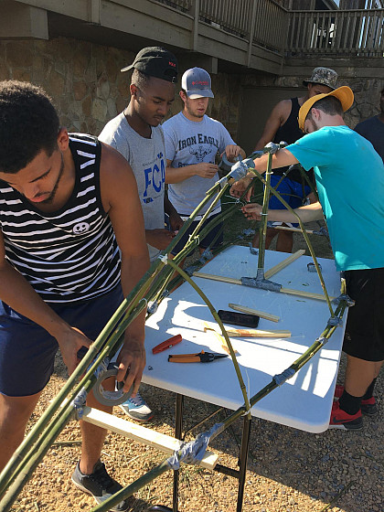 Students building a boat.