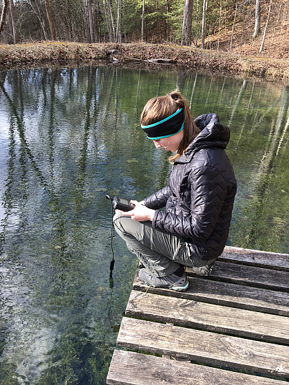 Measuring conductivity in the pond.