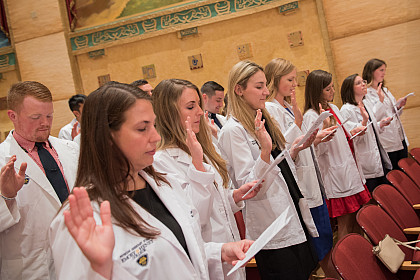 E&H MPAS Class of 2019 Students retaking their PA Student Oath at the 2018 White Coat Ceremony