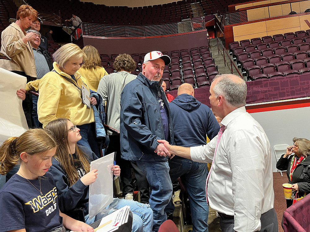 Mike took time after the game to speak to everyone who attended, including Greg Griffin, '87.