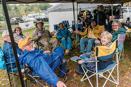 Homecoming 2021: A group of people having a tailgating party.