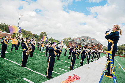 Homecoming 2021: The band plays on the football field.