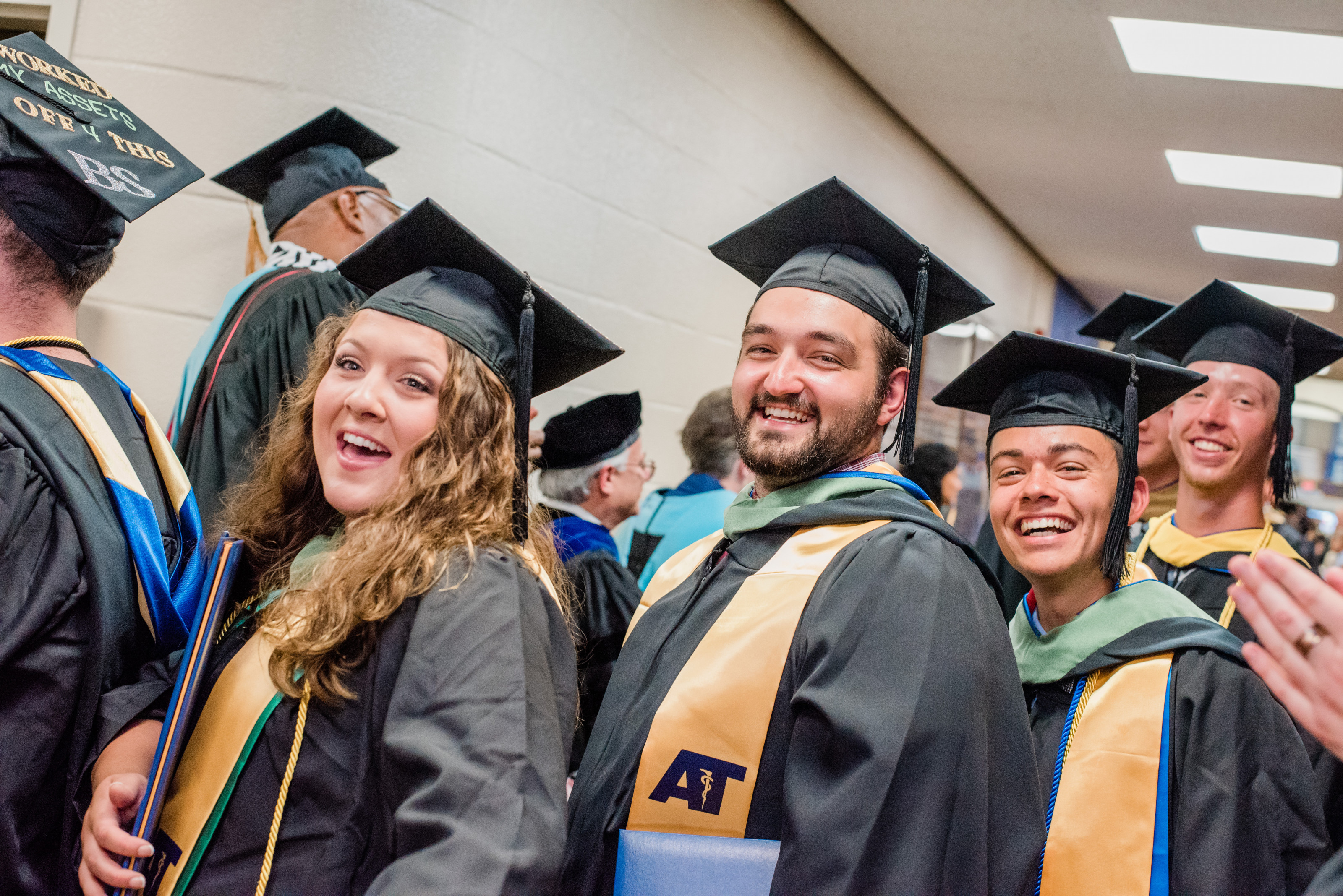 2019 grads smiling through the gauntlet