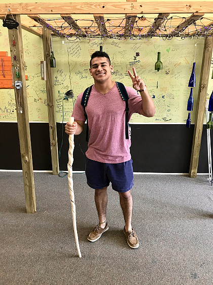 New student, George Jones, buys his first ever hiking stick!