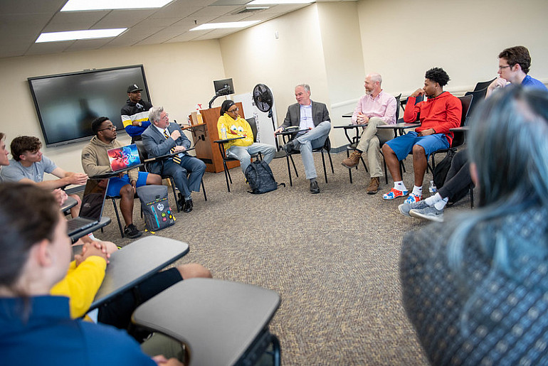 Senator Tim Kaine speaks with students in the CVIN 200: Social Movements class during Spring 2022...