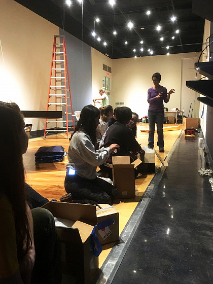 Students enrolled in museum studies classes, work alongside artist Kelly O'Briant with her installation of Atmosphere: Material and ...