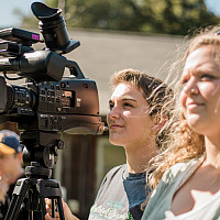 E&H Media and Communication students filming with camera