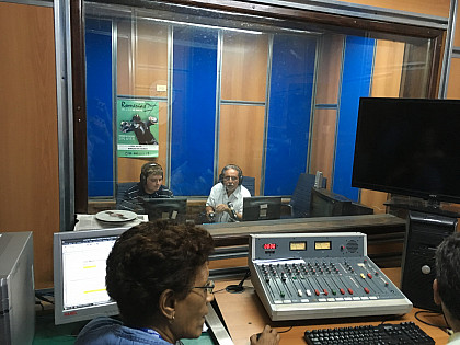Andrew McClung '19 does a mock interview with a host of Radio Habana Cuba, while on a tour of the radio station.