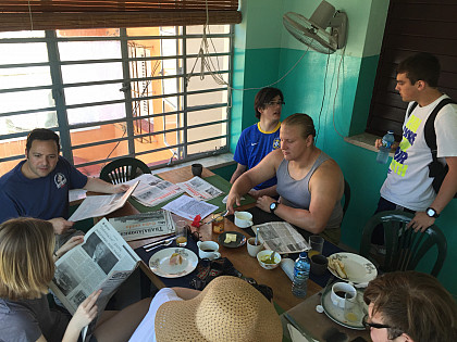 Reading the news while having breakfast at Estudio Sampere La Habana, before Spanish language classes.