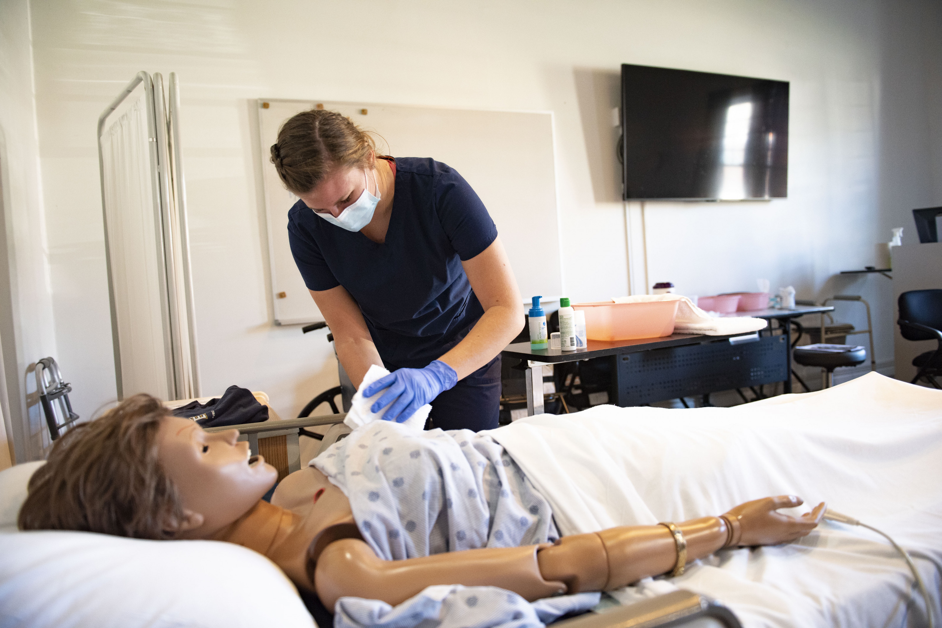 CNA student bathing patient