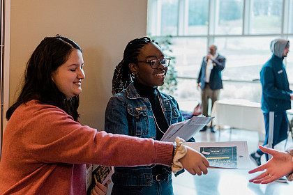 Students welcome those attending the keynote address.