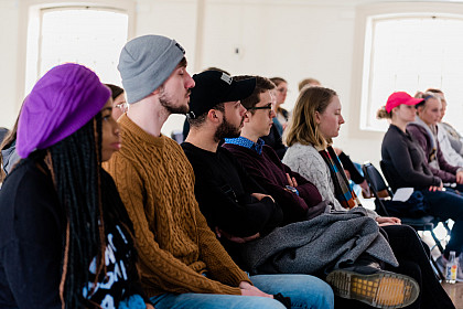 Students listen during a breakout session.