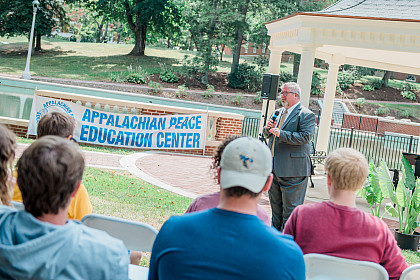 John Wells speaks during a rally for Climate Change.