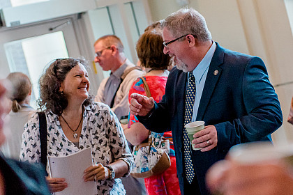 John Well speaks with faculty during Opening Week.