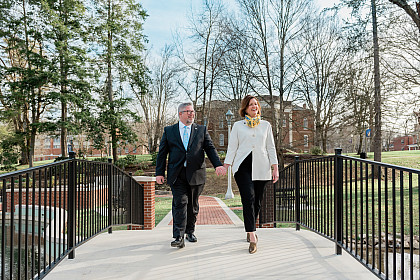 John Wells along wife Shannon walk on campus.