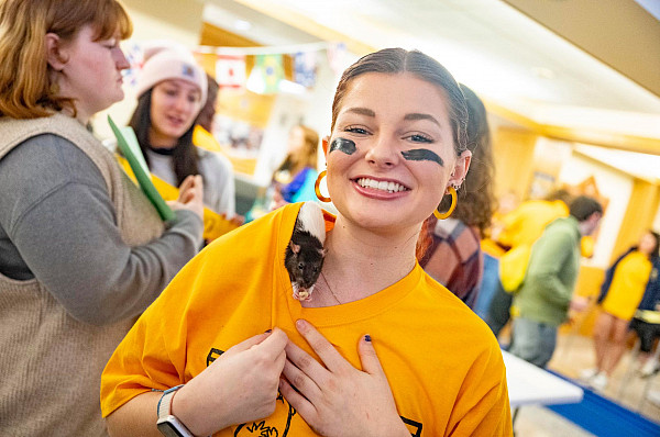 Amelia Terry, Class of 2025, with Koko at the Rat Games! The Rat Games are a part of the psychology department curriculum that emphasize ...