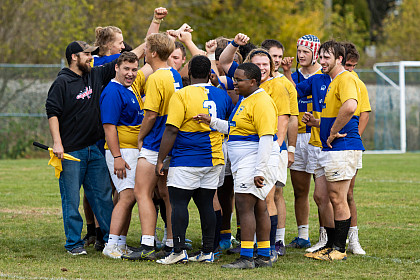 The E&H Men's Rugby team huddles up.