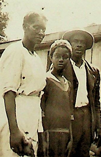 Mrs. Lillie Boyd Gibbs, left; other persons unidentified, Blacksburg Community