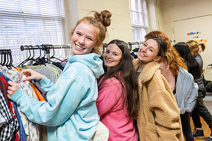 Students pose while shopping.