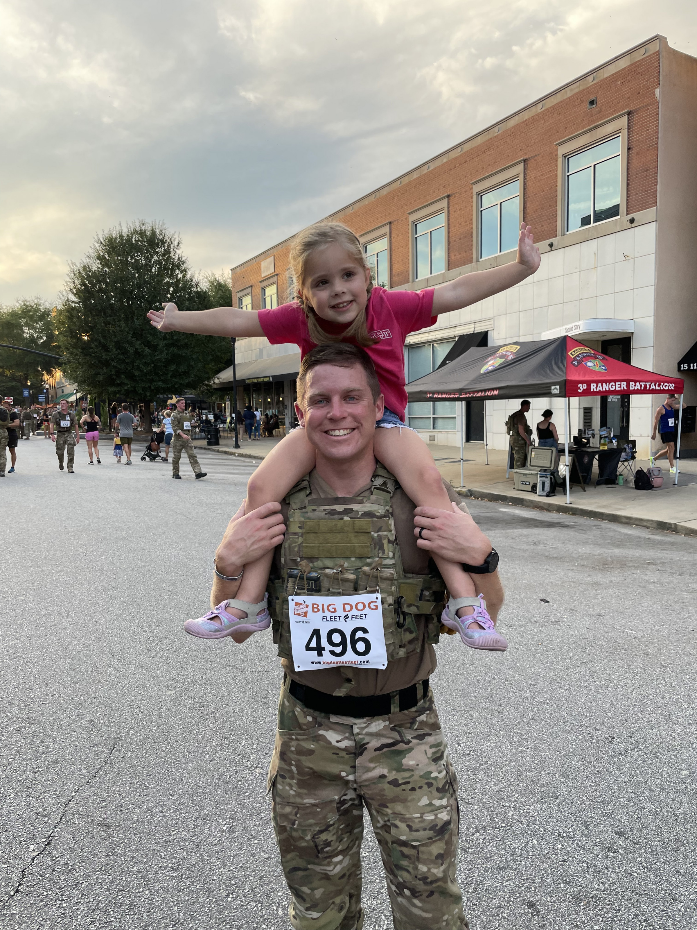 Man with daughter on his shoulders