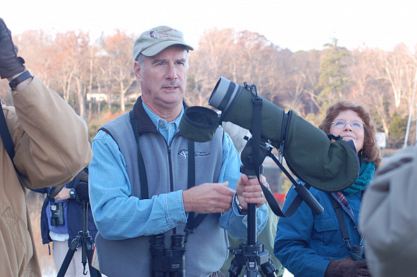 Man with spotting scope for birding.