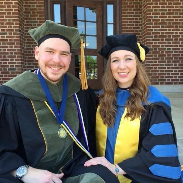 Cortney Halsey ('15) and Jeremiah Jessee ('15) in full academic regalia.