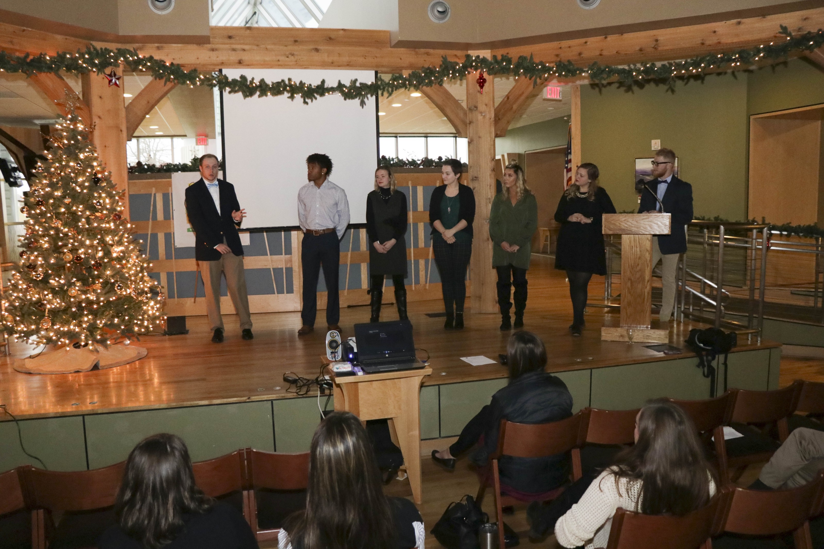 All of the students gather to talk about the professional lessons learned on the project.