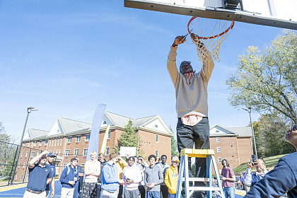 Ceremonial net cutting by Scottie Burke, teammate of Eric Scott '88