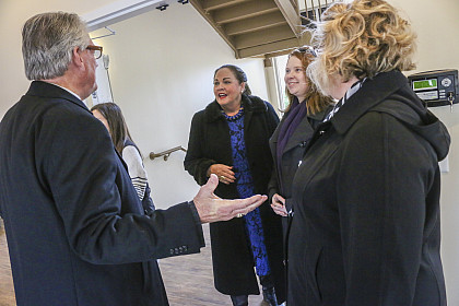 President Jake Schrum speaks to guests at the ribbon cutting for The Village Community Center.