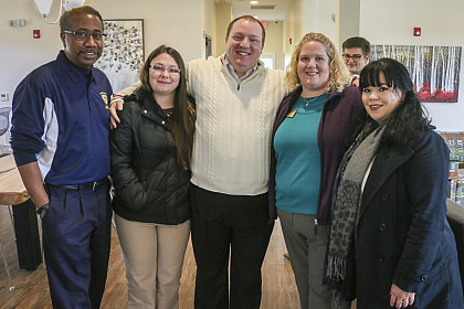 Student Life staff pause for a picture prior to the ribbon cutting.