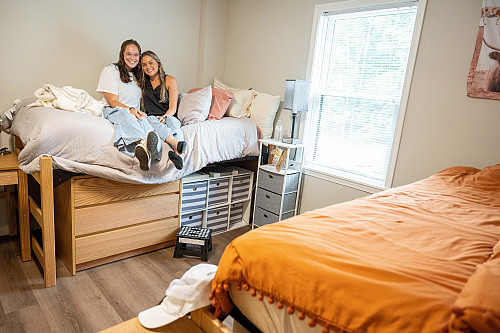 Makenzie Harris '25 and Chloe Jones '25 show off their new rooms at the Emory &...