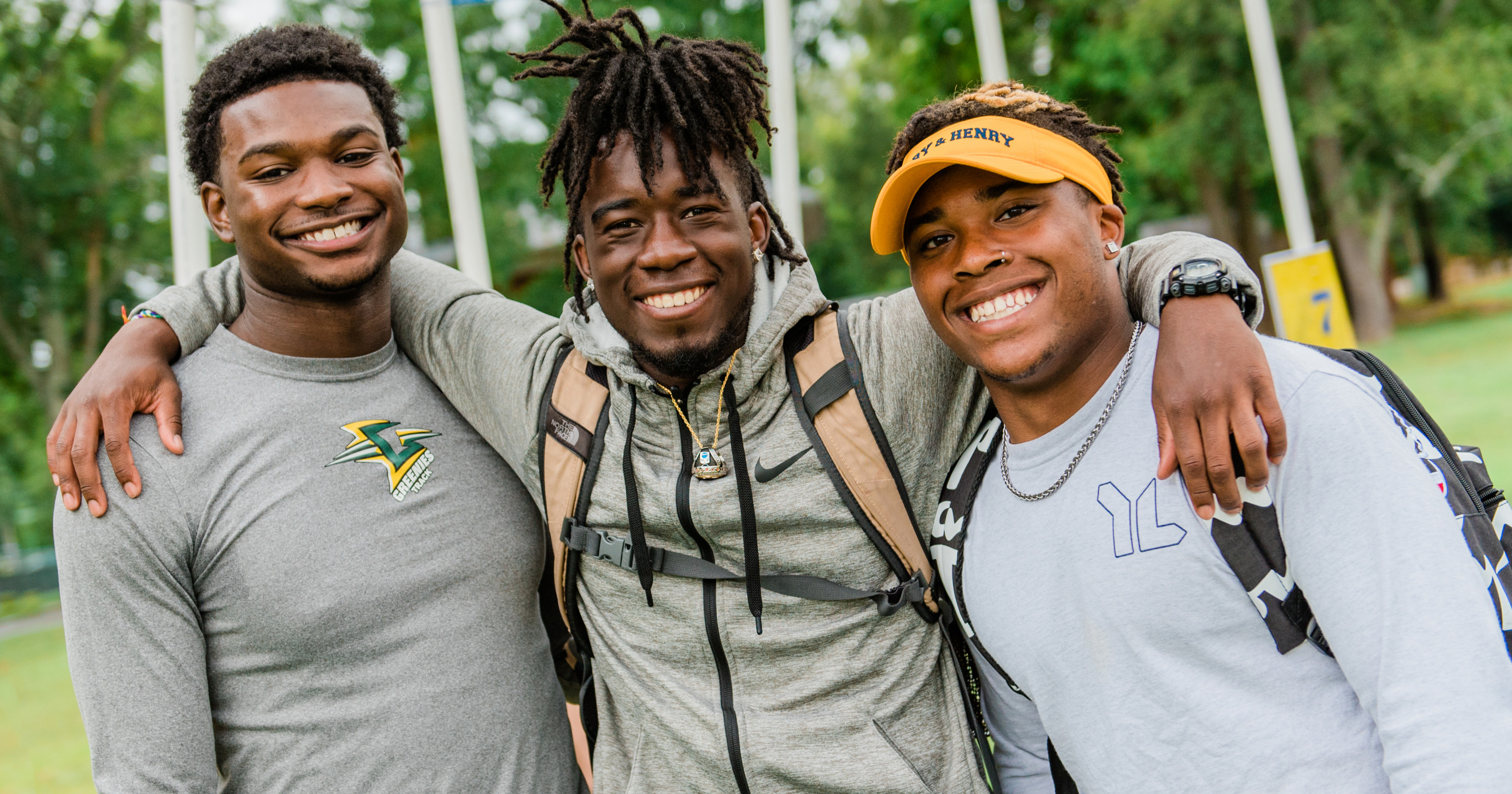 Students smiling on campus.