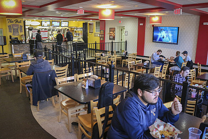 Students order food from the HUT, a popular dining location on campus.