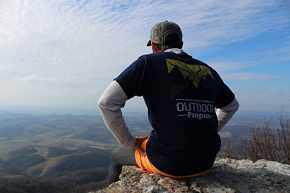 Jake Caudill, a Trip Leader for the Outdoor Program, sits atop Raven's Rock.